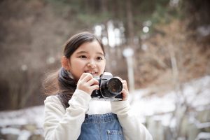 woman taking photo with camera